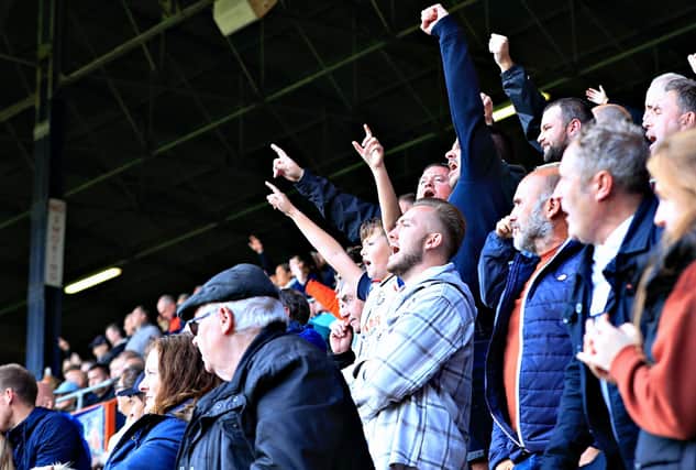 Luton fans celebrate during their 3-1 win over QPR on Saturday
