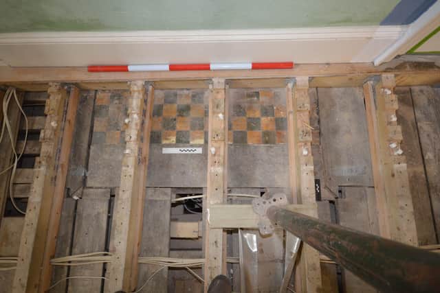 Plate 15 Hearth of the north end fireplace on the ground floor
