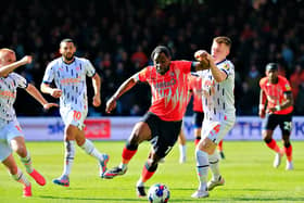 Hatters midfielder Pelly-Ruddock Mpanzu looks to break away against Blackpool
