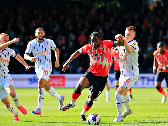 Hatters midfielder Pelly-Ruddock Mpanzu looks to break away against Blackpool