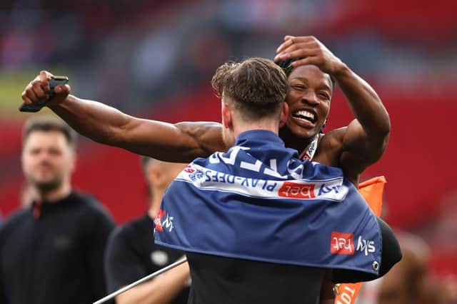 Gabe Osho celebrates winning promotion to the Premier League at Wembley