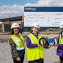 Bellway Senior Sales Manager, Lindsey Davenport with Head Teacher of Thornhill Primary school, Bernice Waite, and the head boy are girl of the school Zohair and Eva.