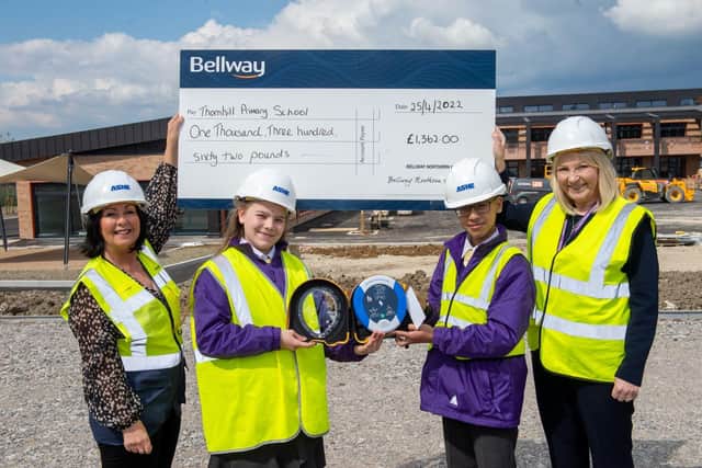 Bellway Senior Sales Manager, Lindsey Davenport with Head Teacher of Thornhill Primary school, Bernice Waite, and the head boy are girl of the school Zohair and Eva.