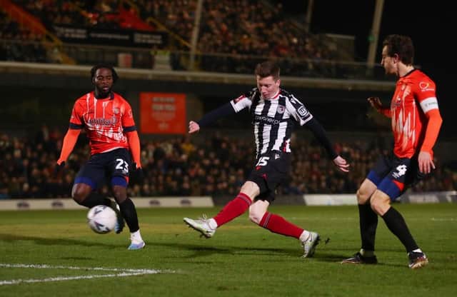 Harry Clifton puts Grimsby in front against Luton this evening