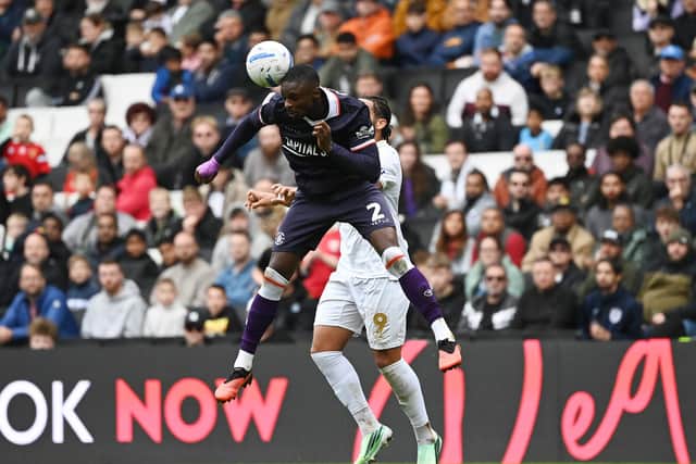 Hakeem Odoffin gets up to head the ball away - pic: Jane Russell