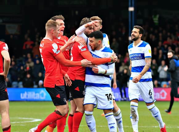 Luton's players surround QPR's Ilias Chair after he shoved Tom Lockyer to the ground at half time during last season's 2-1 defeat