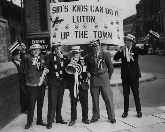 A group of Luton Town supporters gather at London's St Pancras station on their way to the 1959 FA Cup Final against Nottingham Forest at Wembley. Luton Town were to lose 2-1.