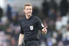 Referee Scott Oldham awarded a penalty against Luton this afternoon