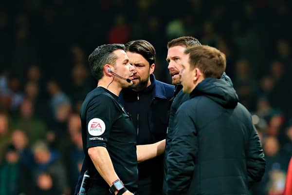 Russell Martin and Rob Edwards are spoken to by referee Dean Whitestone on Saturday