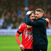 Town defender Tom Lockyer gets a hug from manager Rob Edwards after beating Watford 2-0