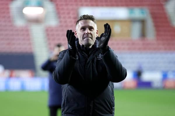 Town manager Rob Edwards applauds the Luton supporters after Tuesday night's FA Cup win