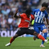 Issa Kabore vies with Brighton midfielder Kaoru Mitoma for the ball at the Amex Stadium - pic: JUSTIN TALLIS/AFP via Getty Images