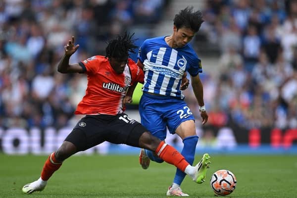 Issa Kabore vies with Brighton midfielder Kaoru Mitoma for the ball at the Amex Stadium - pic: JUSTIN TALLIS/AFP via Getty Images