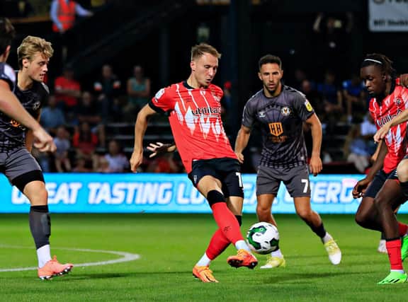 Cauley Woodrow lays the ball off against Newport in midweek