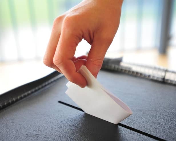 File photo of a person casting a vote
