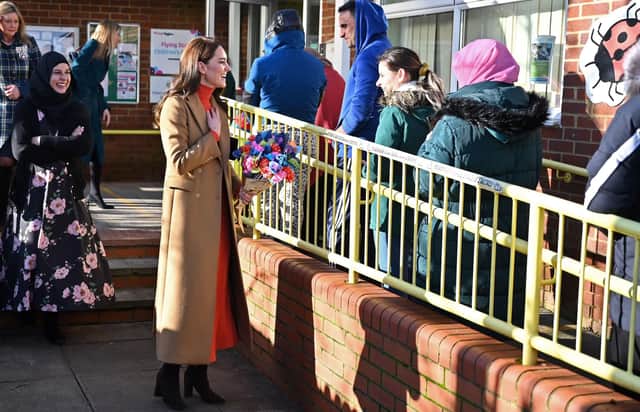 Catherine, Princess of Wales talks with parents waiting to collect their children as she leaves after visiting the Foxcubs Nursery. (Photo by Justin Tallis - WPA Pool/Getty Images)