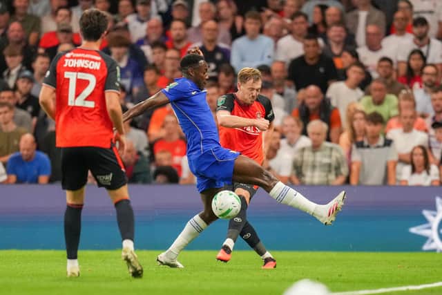 George Johnston looks to clear the ball against Chelsea on Thursday night - pic: David Horn / PRiME Media Images