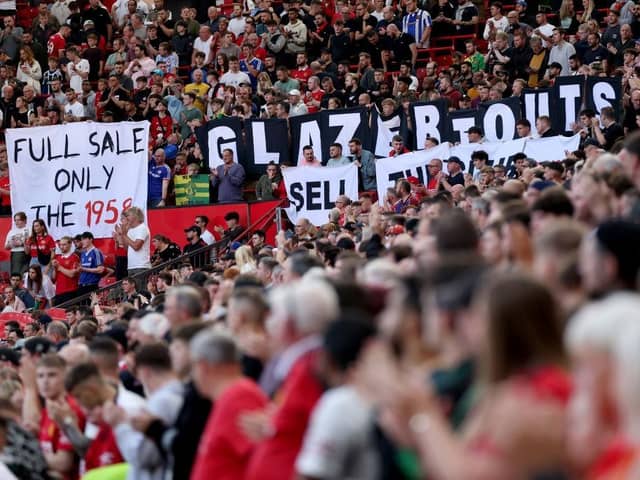 Manchester United fans hold banners in protest against the clubs owners before their match against Brentford recently - pic: Alex Livesey/Getty Images