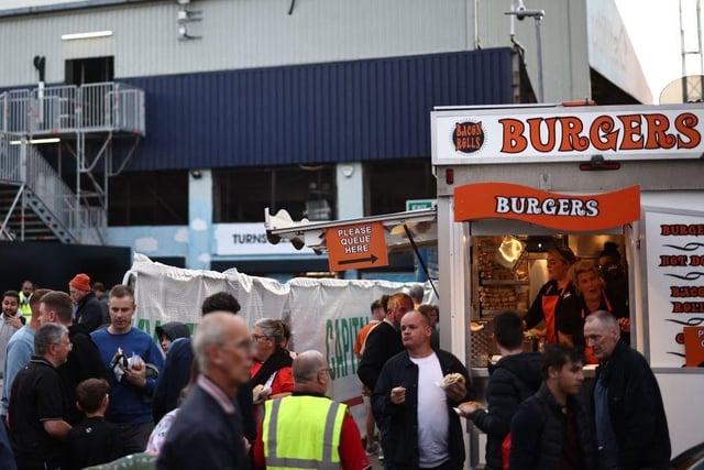 Luton fans gather outside Kenilworth Road ahead of the contest.