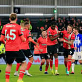 Luton striker Elijah Adebayo wheels away after making it 3-0 against Brighton - pic: Liam Smith