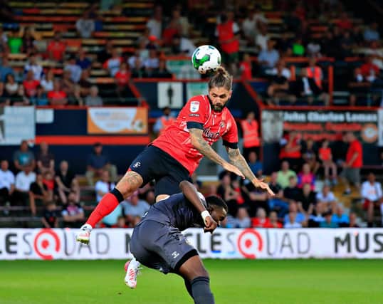 Henri Lansbury is back on the bench for Luton this evening