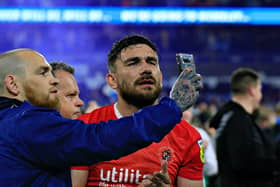 Former Hatter Robert Snodgrass is accosted by a Huddersfield fan following the play-off semi-final defeat last season