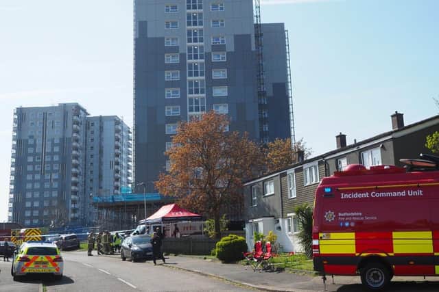 Police say a man in his 50s died after falling from a window on the 14th floor of a block of flats in Luton.