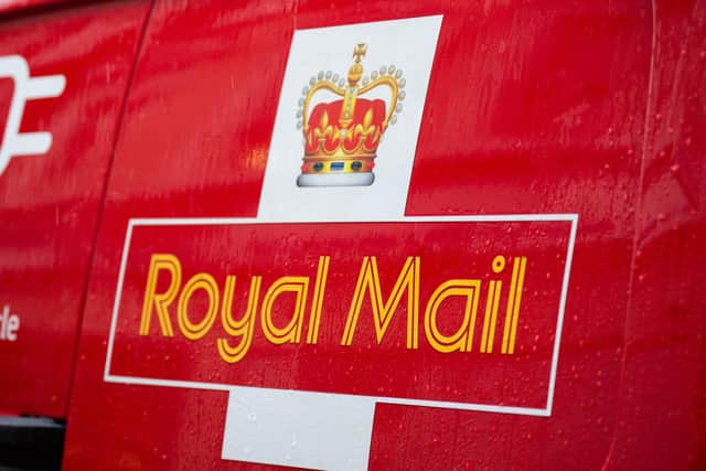 A Royal Mail logo on a van
