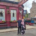 Bereaved parents Khuram Liaquat and Yasmin Stannard outside the Queen Victoria pub in EastEnders