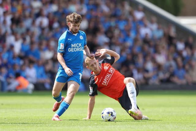 George Saville gets stuck in against Peterborough on Saturday - pic: Joe Dent/theposh.com