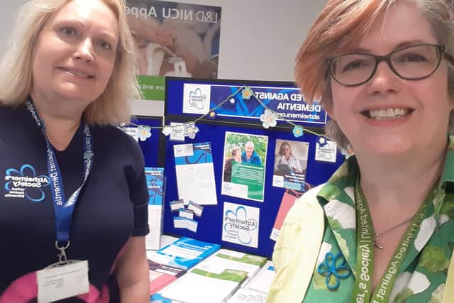 Louise Buckingham, Alzheimer's Society Dementia Support Worker in Luton with Catherine Bishop, Alzheimer's Society Dementia Support Worker in Bedfordshire, with one of their pop-up stalls this Dementia Action Week.