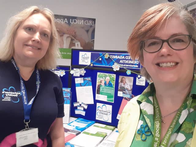 Louise Buckingham, Alzheimer's Society Dementia Support Worker in Luton with Catherine Bishop, Alzheimer's Society Dementia Support Worker in Bedfordshire, with one of their pop-up stalls this Dementia Action Week.