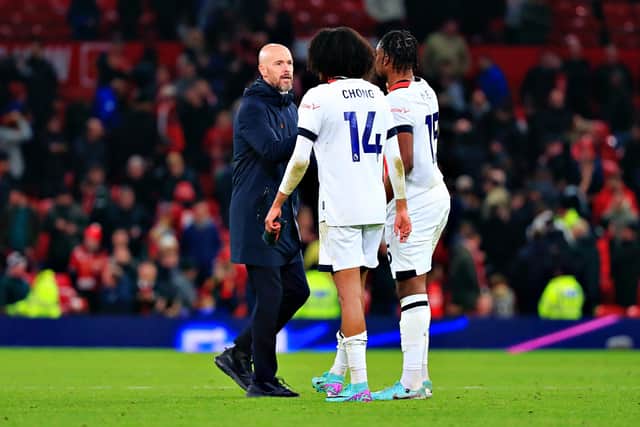 Ex-Manchester United players Teden Mengi and Tahith Chong speak to their former manager Erik ten Hag after Town's 1-0 loss on Saturday - pic: Liam Smith