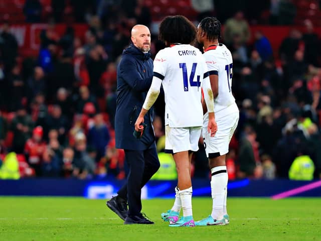 Ex-Manchester United players Teden Mengi and Tahith Chong speak to their former manager Erik ten Hag after Town's 1-0 loss on Saturday - pic: Liam Smith