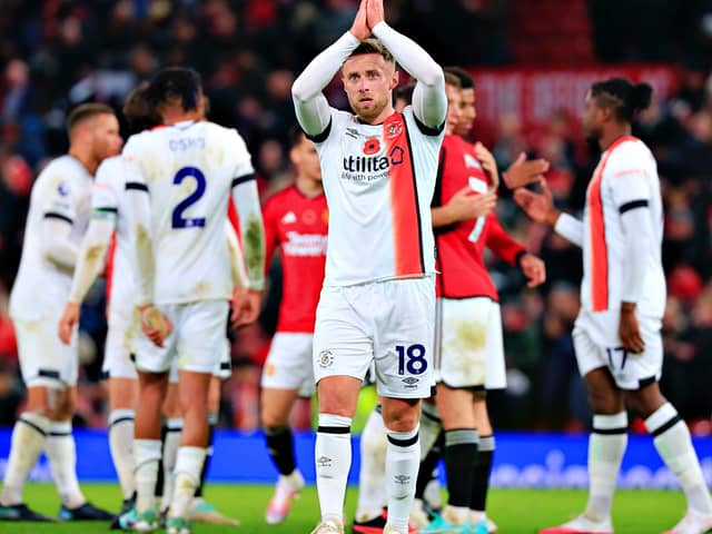 Jordan Clark applauds the Luton supporters after Town's 1-0 defeat to Manchester United on Saturday - pic: Liam Smith
