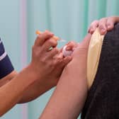 A patient receives an injection of a Covid-19 vaccine