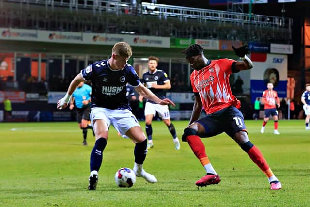 Elijah Adebayo looks to nutmeg a Millwall defender on Tuesday night