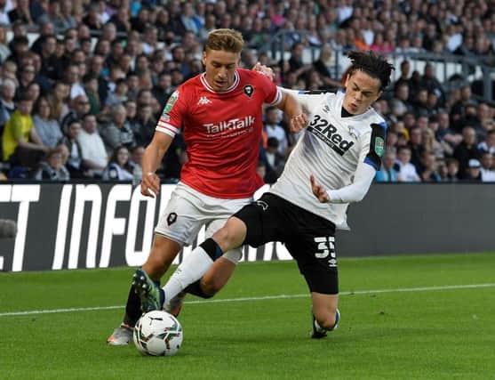 New Town midfielder Louie Watson in action for Derby County