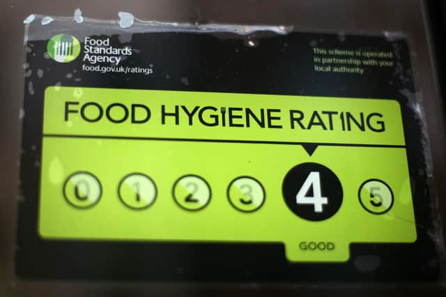 A Food Standards Agency rating certificate in the window. Photo by Carl Court/Getty Images