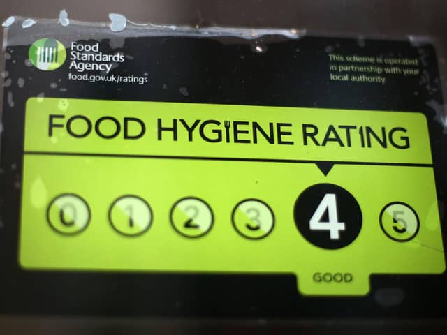 A Food Standards Agency rating certificate in the window. Photo by Carl Court/Getty Images
