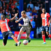 Hatters midfielder Marvelous Nakamba slides in to try and dispossess Tottenham's James Maddison on Saturday - pic: Liam Smith