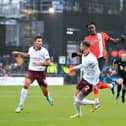 Elijah Adebayo wins the ball during the Hatters' 2-1 defeat to Manchester City back in December - pic: Liam Smith