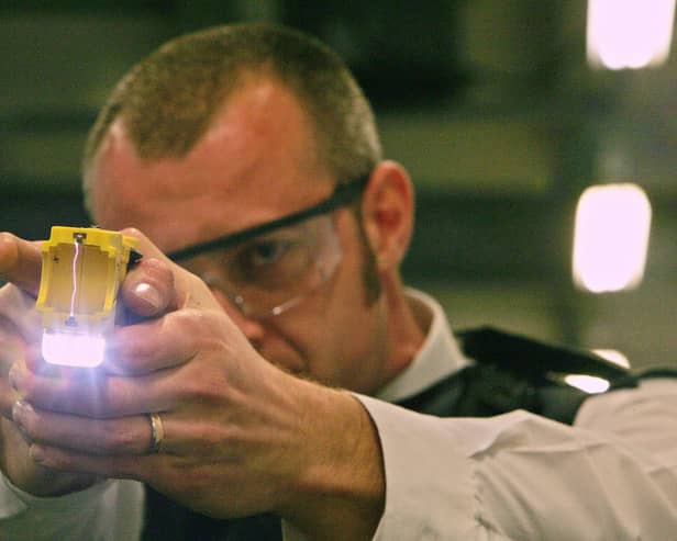 A police officer trains using a taser gun at the Metropolitan Police Specialist Training Centre. Picture: CARL DE SOUZA/AFP via Getty Images