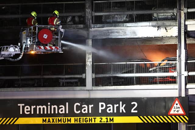 Firemen battle the fire at Luton Airport which caused a partial collapse of a parking structure in Luton on October 11, 2023. . Photo by HENRY NICHOLLS/AFP via Getty Images