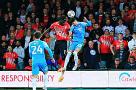 Town striker Elijah Adebayo gets up to win a header against Sunderland