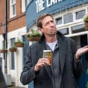 Peter Crouch with his pint. Picture: Greene King