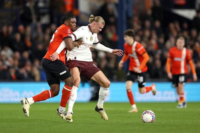 Luton defender Teden Mengi tries to stop Manchester City striker Erling Haaland this evening - pic: Richard Heathcote/Getty Images