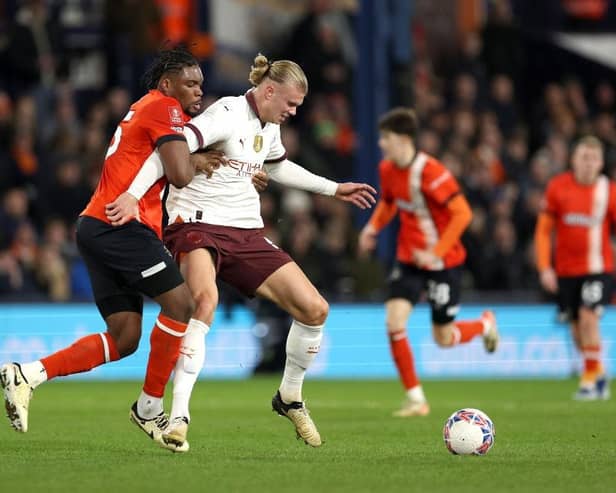 Luton defender Teden Mengi tries to stop Manchester City striker Erling Haaland this evening - pic: Richard Heathcote/Getty Images