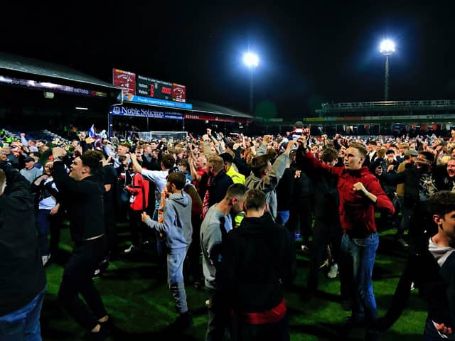 Luton fans celebrate on the pitch after beating Sunderland in the play-offs - pic: Liam Smith