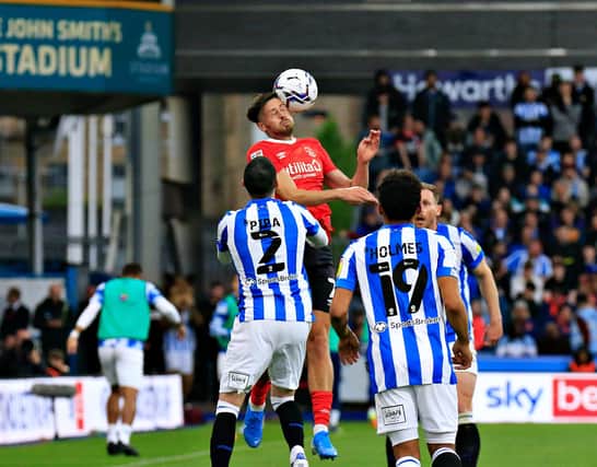 Harry Cornick wins a header during Luton's play-off semi-final defeat at Huddersfield
